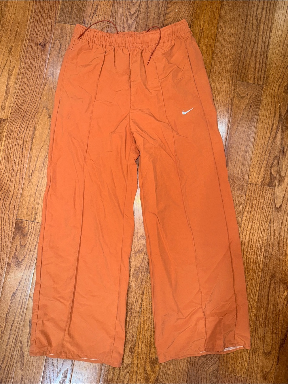Nike Orange Kids Track Pants with White Swoosh